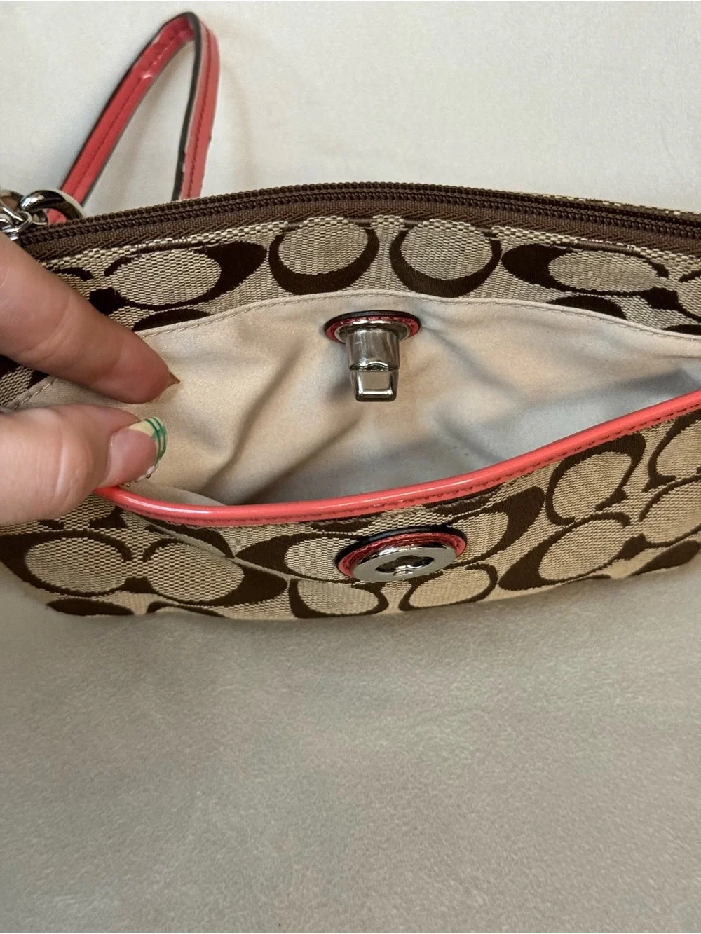 Coach Turnlock Signature Canvas Wristlet with Pink Trim